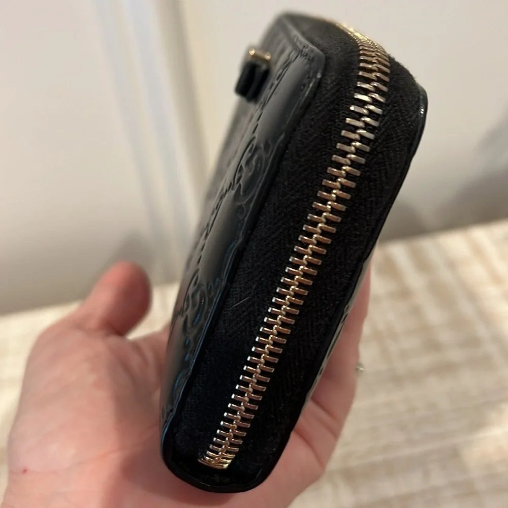 Gucci Black Embossed GG Leather Zip Wallet with Gold Tone Accent